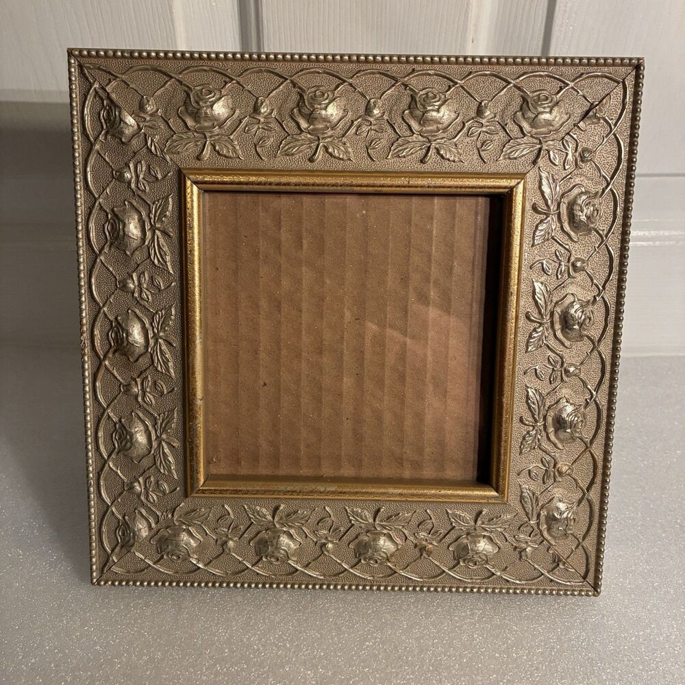 Ornate Metal tan and gold picture frame. measures 8.5"x8.5" & w/ square opening